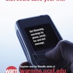 a poster showing a hand holding a cell phone. The poster says 'Sign up for the warning that could save your life.'